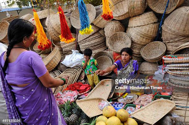 Hindu devotees are out for shopping ahead of the upcoming Chhath Puja festival at a market, on November 14, 2015 in Noida, India. The Chhath...