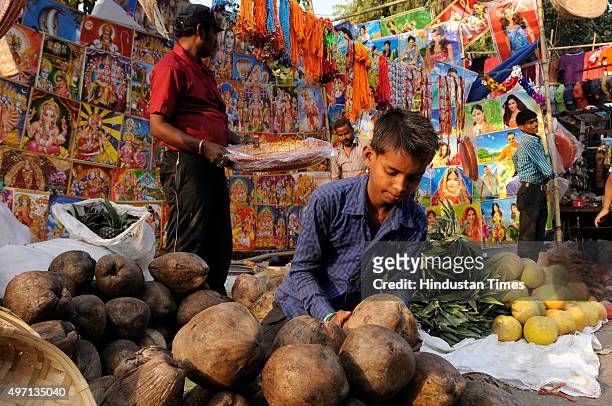 Hindu devotees purchasing religious items for the upcoming Chhath Puja festival at a market, on November 14, 2015 in Noida, India. The Chhath...