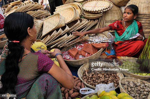 Hindu devotees are out for shopping ahead of the upcoming Chhath Puja festival at a market, on November 14, 2015 in Noida, India. The Chhath...