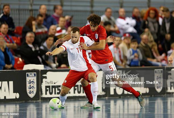 Max Kilman of England and Rafal Franz of Poland during the Futsal Interantional match between England and Poland at St Georges Park on November 14,...