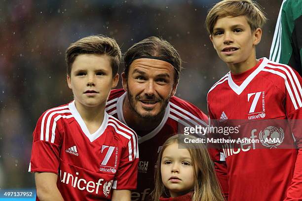 David Beckham of Great Britain and Ireland XI with his children Cruz, Harper and Romeo prior to the David Beckham Match for Children in aid of UNICEF...