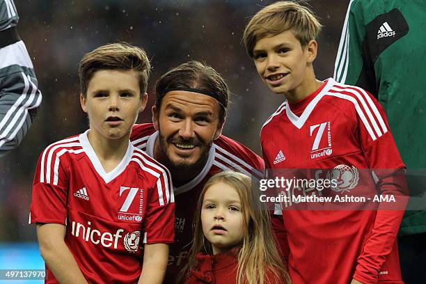 David Beckham of Great Britain and Ireland XI with his children Cruz, Harper and Romeo prior to the David Beckham Match for Children in aid of UNICEF...