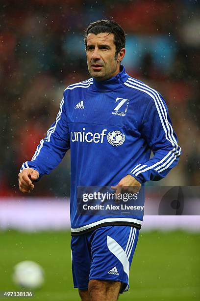 Luis Figo of the Rest of the World warms up prior to kickoff during the David Beckham Match for Children in aid of UNICEF between Great Britain &...