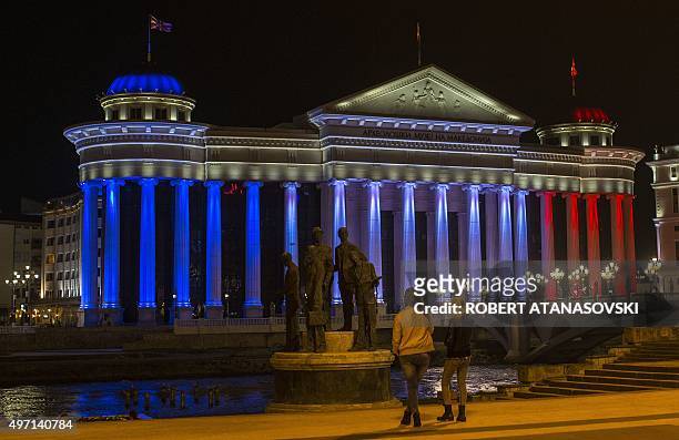 Archeological museum is illuminated with the colours of the French national flag in Skopje on November 14 in tribute to the victims of deadly attacks...