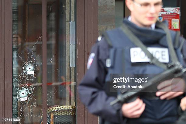 Bullet holes are seen as the French police takes security measures at Bataclan concert hall and "La Belle Equipe" restaurant in 11th district of...