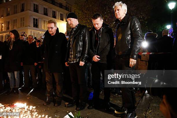 The Irish band U2 lay flowers at a memorial site near the Bataclan concert hall, where more than 80 people were killed, in Paris, France on Saturday,...