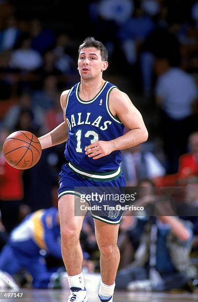 Mike Iuzzolino of the Dallas Mavericks dribbles the ball during a game against the Denver Nuggets.