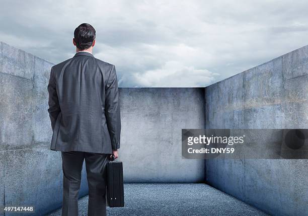 businessman looking at a dead end - back shot position stock pictures, royalty-free photos & images