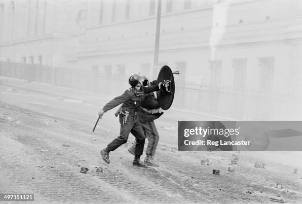 Riot police outside a bulding occupied by protestors during civil unrest in the streets around the Sorbonne in Paris, 12th June 1968.