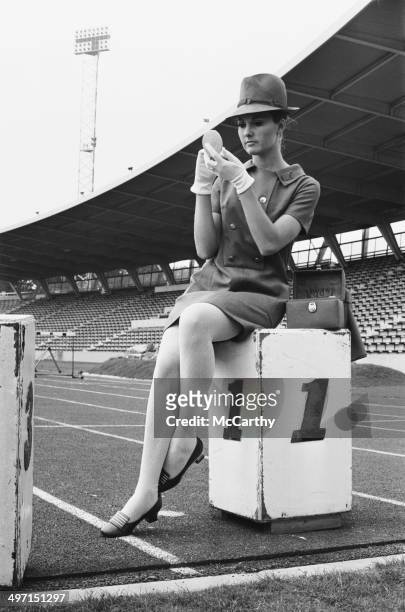 Model wearing the uniform, designed by Hardy Amies, to be worn by female British athletes in the parade at the 1968 Olympic Games in Mexico City,...