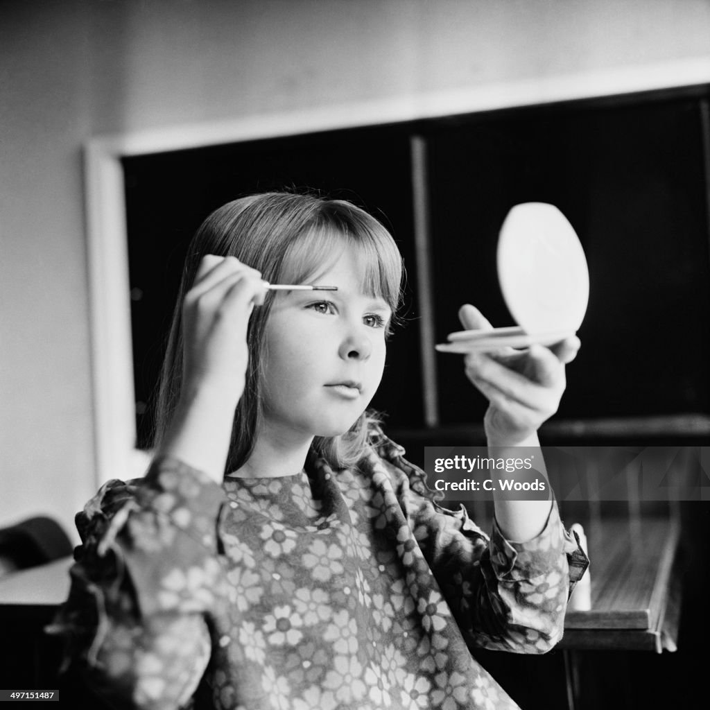 Young Girl Putting On Make Up