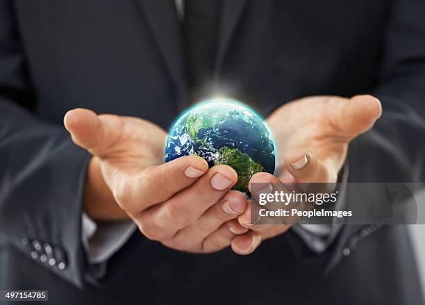 in touch with the world - globe businessman stockfoto's en -beelden