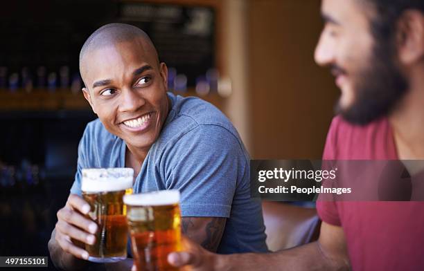 cheers mate! - male friends drinking beer stock pictures, royalty-free photos & images