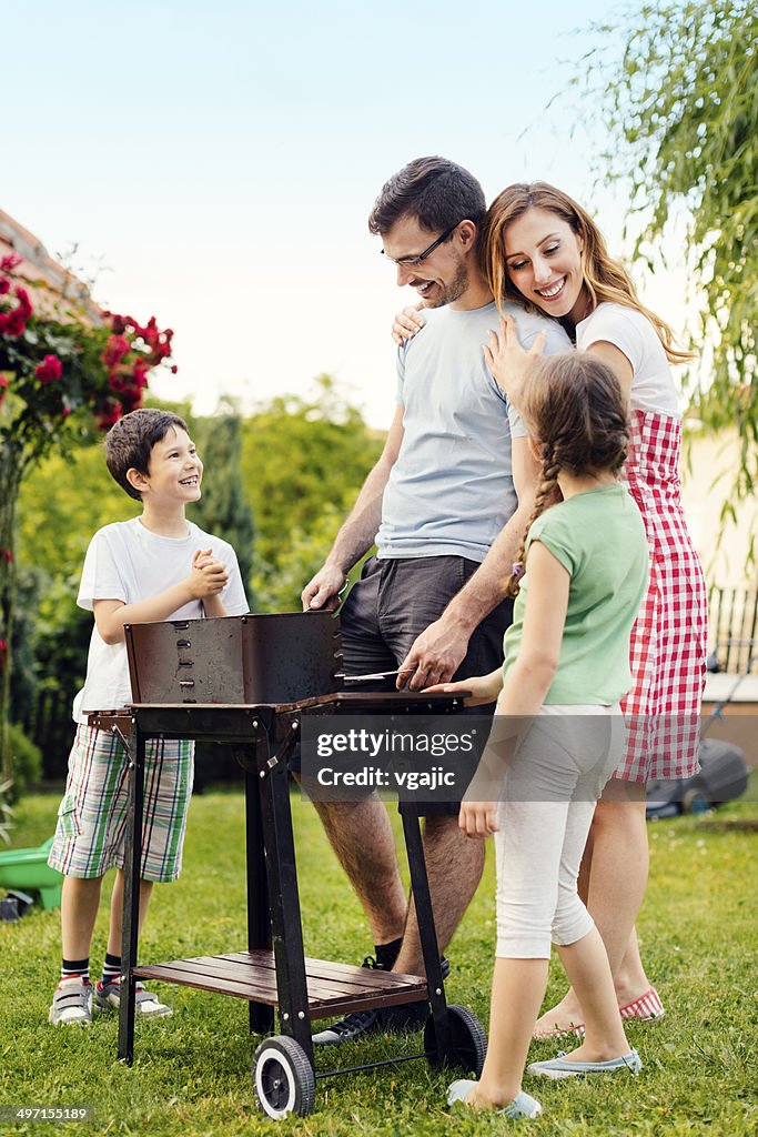 Family Enjoying a barbecue.