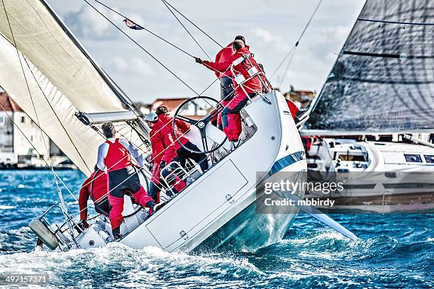 sailing crew on sailboat during regatta - race unity stock pictures, royalty-free photos & images