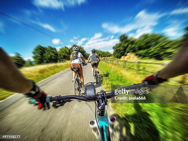 mountain bicycle in group: on a road in tuscany - extreme angle stock pictures, royalty-free photos & images