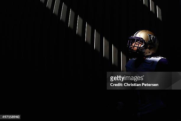 Linebacker Travis Feeney of the Washington Huskies walks out to the field before the college football game against the Arizona State Sun Devils at...