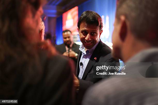 Republican presidential candidate Louisiana Governor Bobby Jindal greets people during the Sunshine Summit conference being held at the Rosen Shingle...