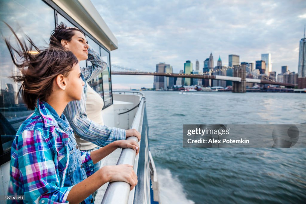 Mother and daughter at ferry at Hudson River