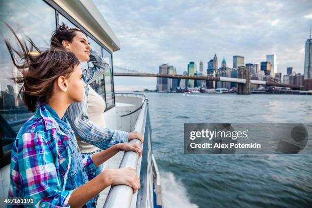 mother and daughter at ferry at hudson river - ferry stock pictures, royalty-free photos & images
