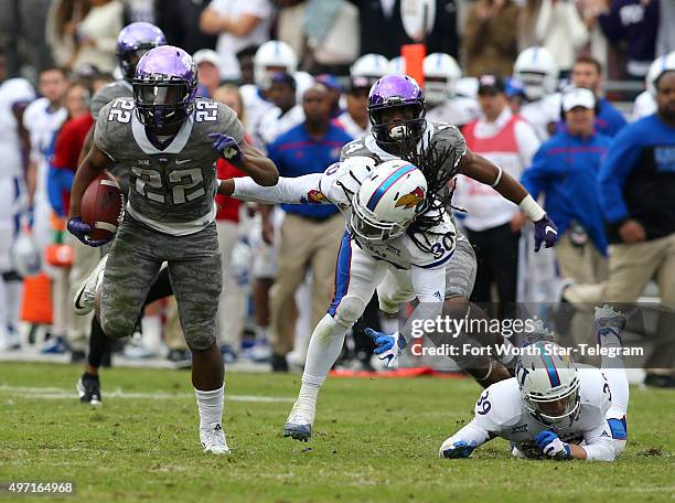 Running back Aaron Green breaks away from Kansas safeties Tevin Shaw and Michael Glatczak in the fourth quarter at Amon G. Carter Stadium in Fort...