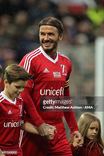 David Beckham of Great Britain and Ireland XI walks out before the David Beckham Match for Children in aid of UNICEF at Old Trafford on November 14,...
