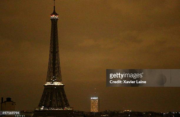 The Eiffel Tower goes dark following a series of terrorist attacks in the French capital on November 14, 2015 in Paris, France. At least 120 people...