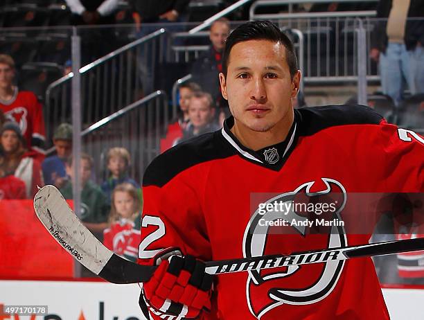 Jordin Tootoo of the New Jersey Devils displays his stick saying # Prayers for Paris in honor of last nights terrorist attack during warmups prior to...