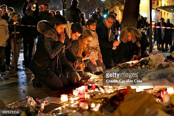 Crowd gathers at the Le Bataclan theatre to pay tribute and lay flowers for those who died in the terrorist attacks yesterday, November 14, 2015 in...