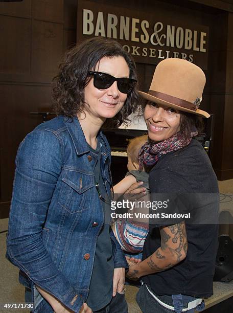 Actress Sara Gilbert and singer-songwriter Linda Perry attend their musical performance at The Grove at Barnes & Noble at The Grove on November 14,...