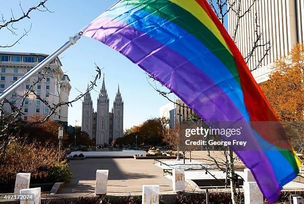 Pride flag flies in front of the Historic Mormon Temple as part of a protest where people resigned from the Church of Jesus Christ of Latter-Day...