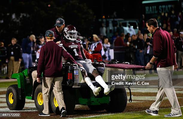 De'Runnya Wilson of the Mississippi State Bulldogs is carted off the field after an injury during the fourth quarter against the Alabama Crimson Tide...