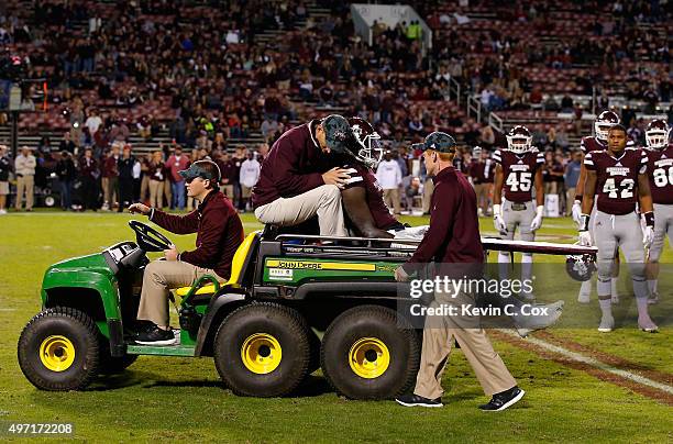 De'Runnya Wilson of the Mississippi State Bulldogs is carted off the field after an injury during the fourth quarter against the Alabama Crimson Tide...