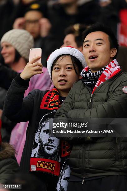 Asian fans wearing a Ryan Giggs scarf during the David Beckham Match for Children in aid of UNICEF at Old Trafford on November 14, 2015 in...