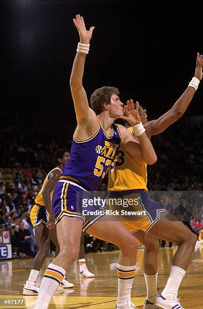 Mark Eaton of the Utah Jazz is guarded by Kareen Abdul-Jabbar of the Los Angeles Lakers during a game. Mandatory Credit: Rick Stewart /Allsport