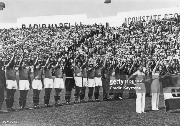 The Italian team performing a fascist salute before the 1934 World Cup Final, at the Stadio Nazionale PNF, Rome, Italy, 10th June 1934.