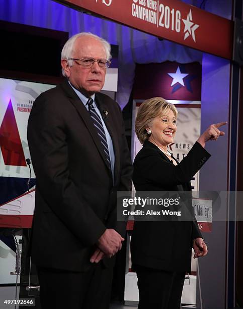 Democratic presidential candidates Sen. Bernie Sanders and Hillary Clinton stand on the stage prior to a presidential debate sponsored by CBS at...