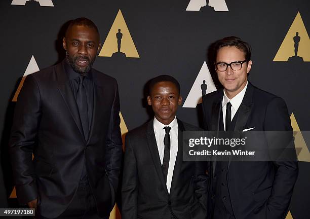 Actors Idris Elba, Abraham Attah and director Cary Joji Fukunaga attend the Academy of Motion Picture Arts and Sciences' 7th annual Governors Awards...