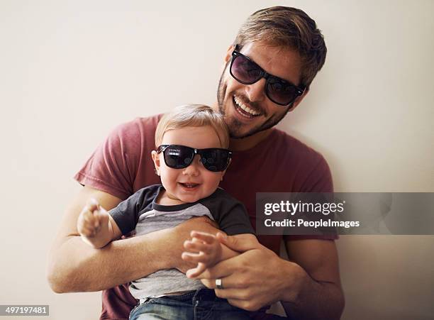 coolness runs in this family! - baby sunglasses stock pictures, royalty-free photos & images