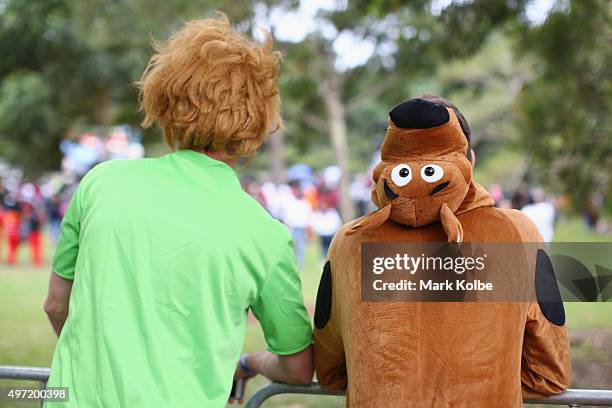 Competitors dressed as Shaggy and Scooby Doo watch on as they wait to compete during the 2015 Red Bull Billy Cart Race at Centennial Park on November...