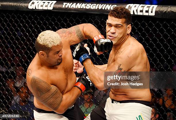 Mark Hunt lands a left-handed punch against Antonio Silva in their heavyweight bout during the UFC 193 event at Etihad Stadium on November 15, 2015...