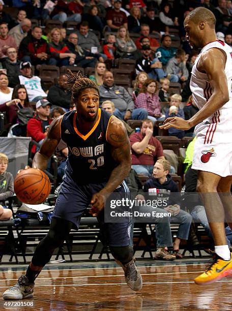 Cartier Martin from the Iowa Energy looks to drive against Tre Kelley from the Sioux Falls Skyforce in the first half of their NBA D-League game...