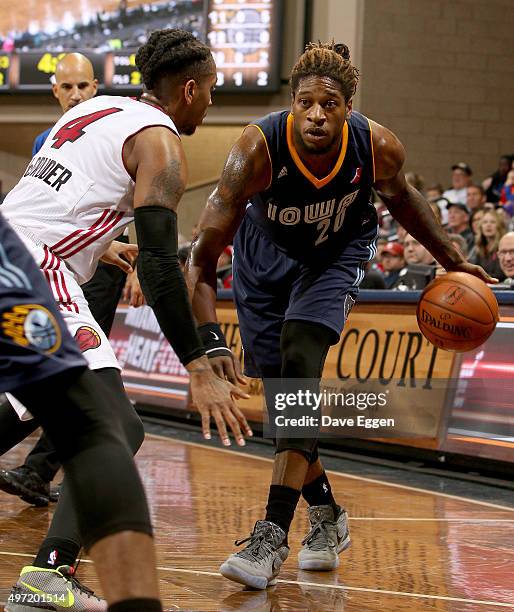 Cartier Martin from the Iowa Energy looks to make a move against Rodney McGruder from the Sioux Falls Skyforce in the first half of their NBA...