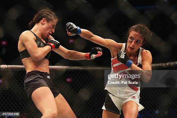 Joanna Jedrzejczyk of Poland and Valerie Letourneau of Canada compete in their UFC women's strawweight championship bout during the UFC 193 event at...