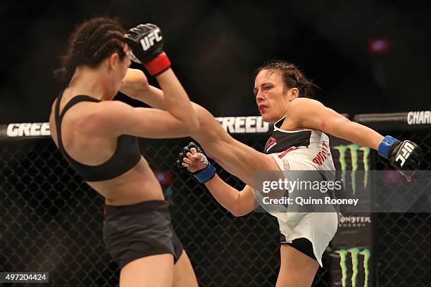 Joanna Jedrzejczyk of Poland and Valerie Letourneau of Canada compete in their UFC women's strawweight championship bout during the UFC 193 event at...