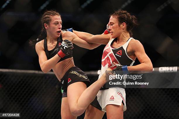 Joanna Jedrzejczyk of Poland and Valerie Letourneau of Canada compete in their UFC women's strawweight championship bout during the UFC 193 event at...