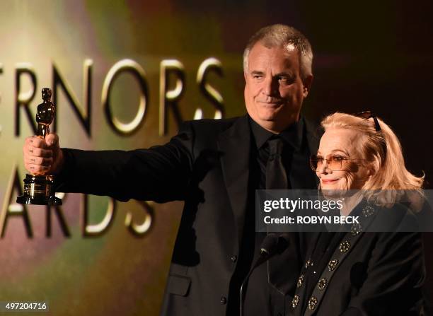 Gena Rowlands looks on as her son Nick Cassavetes holds her award during the 7th annual Governors Awards ceremony presented by the Board of Governors...