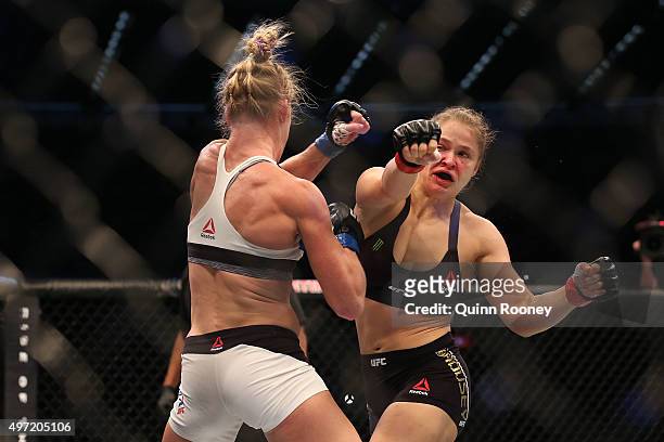 Ronda Rousey of the United States and Holly Holm of the United States compete in their UFC women's bantamweight championship bout during the UFC 193...