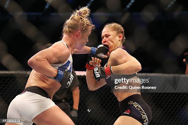 Ronda Rousey of the United States and Holly Holm of the United States compete in their UFC women's bantamweight championship bout during the UFC 193...