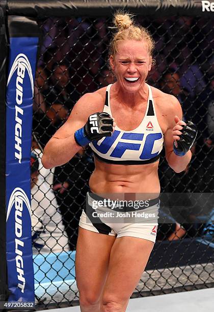 Holly Holm celebrates her second round KO over Ronda Rousey in their UFC women's bantamweight championship bout during the UFC 193 event at Etihad...